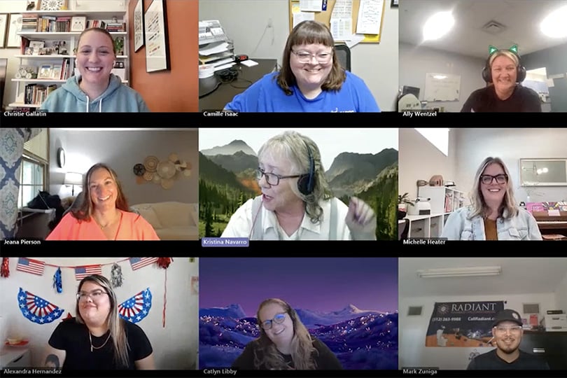 A screenshot of happy T3 employees in a group video call.